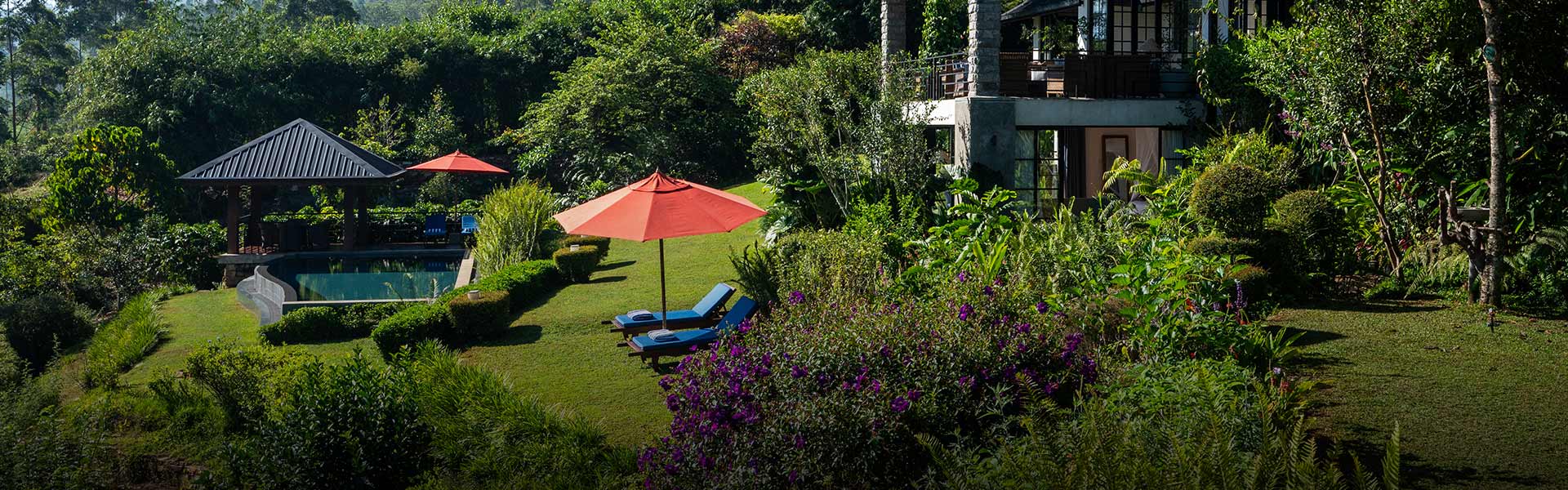 Camellia Hills Sri Lanka provides a romantic setting with a private pool, a cozy sitting area, and lush green surroundings.