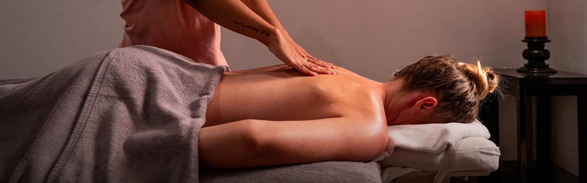 Woman receiving a calming massage, immersed in a luxury spa retreat experience at Teardrop Hotels in Sri Lanka.